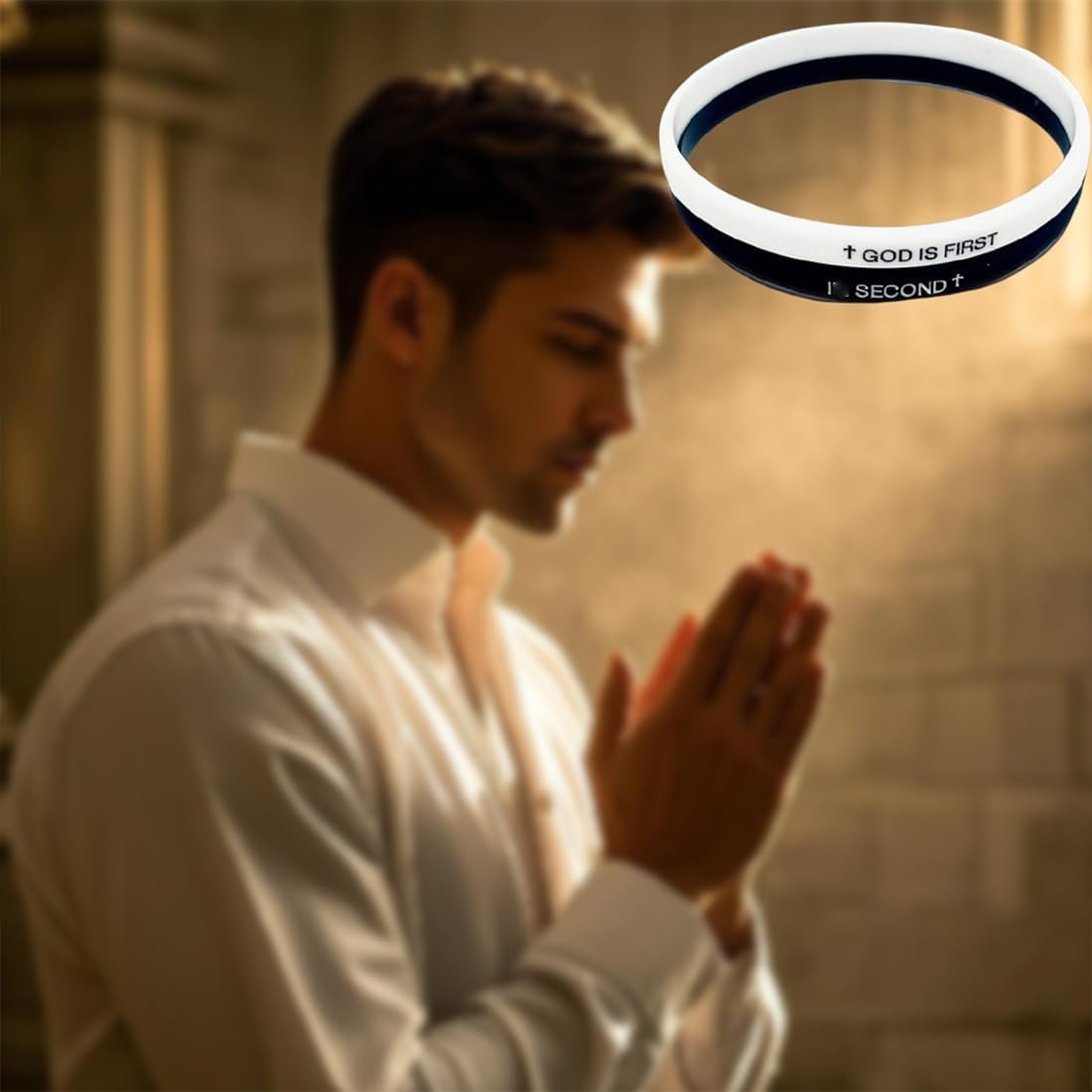 Man praying with a 'God is First' bracelet in the foreground
